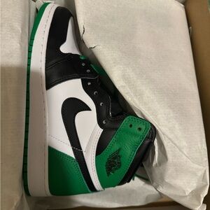 Green and black Nike air Jordan’s